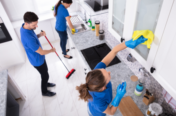 professional team cleaning kitchen