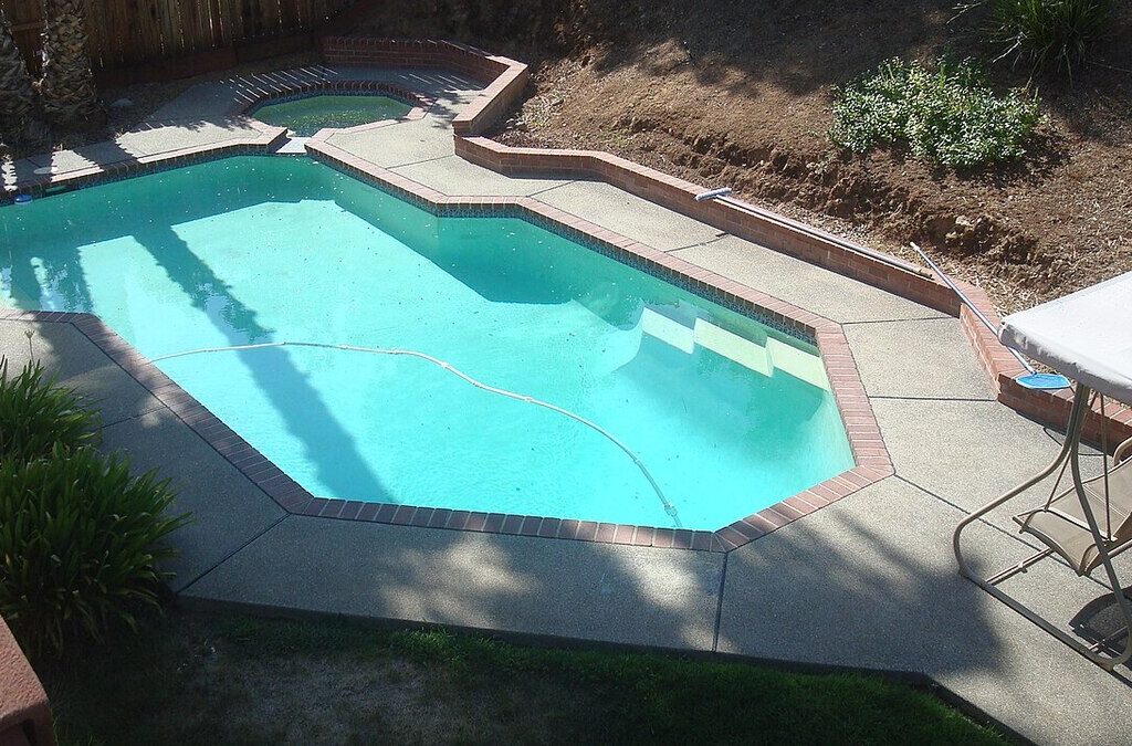 Backyard vacation rental pool needing peak-season maintenance
