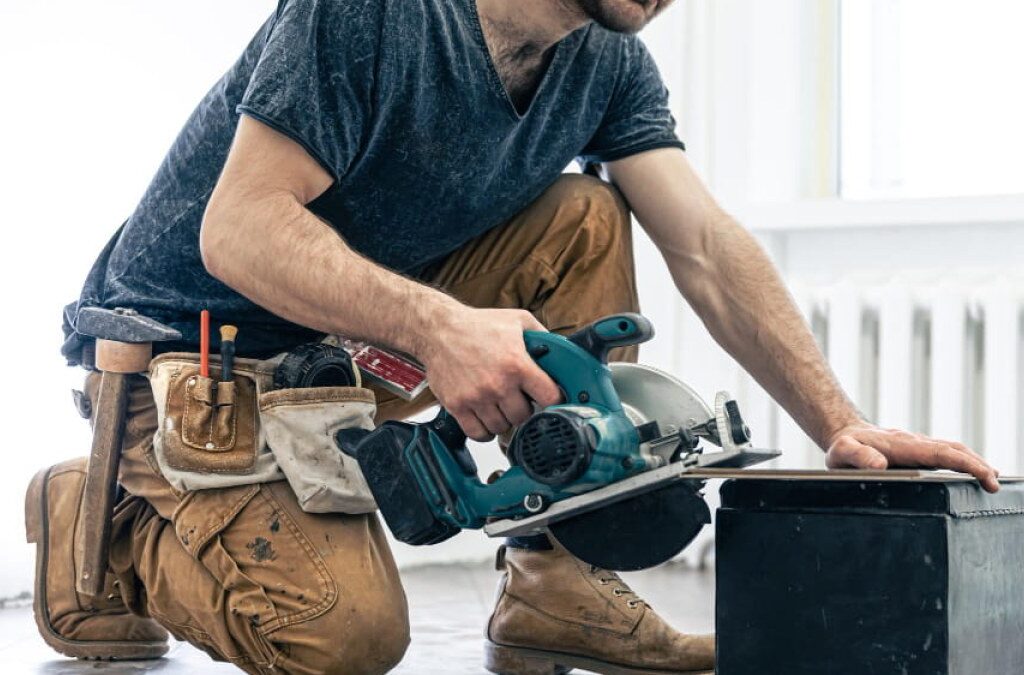 Handyman checking an AC filter as part of a routine maintenance visit on an Orlando rental property