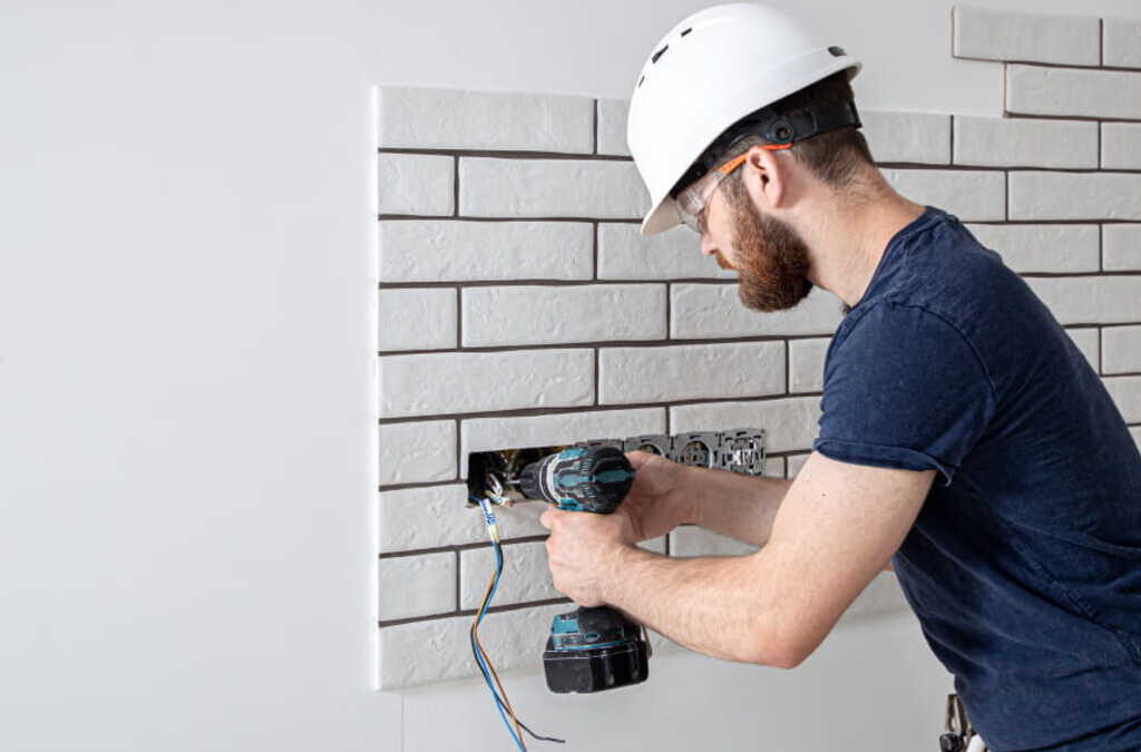 Technician performing routine property maintenance on an Orlando rental as part of a recurring portfolio program