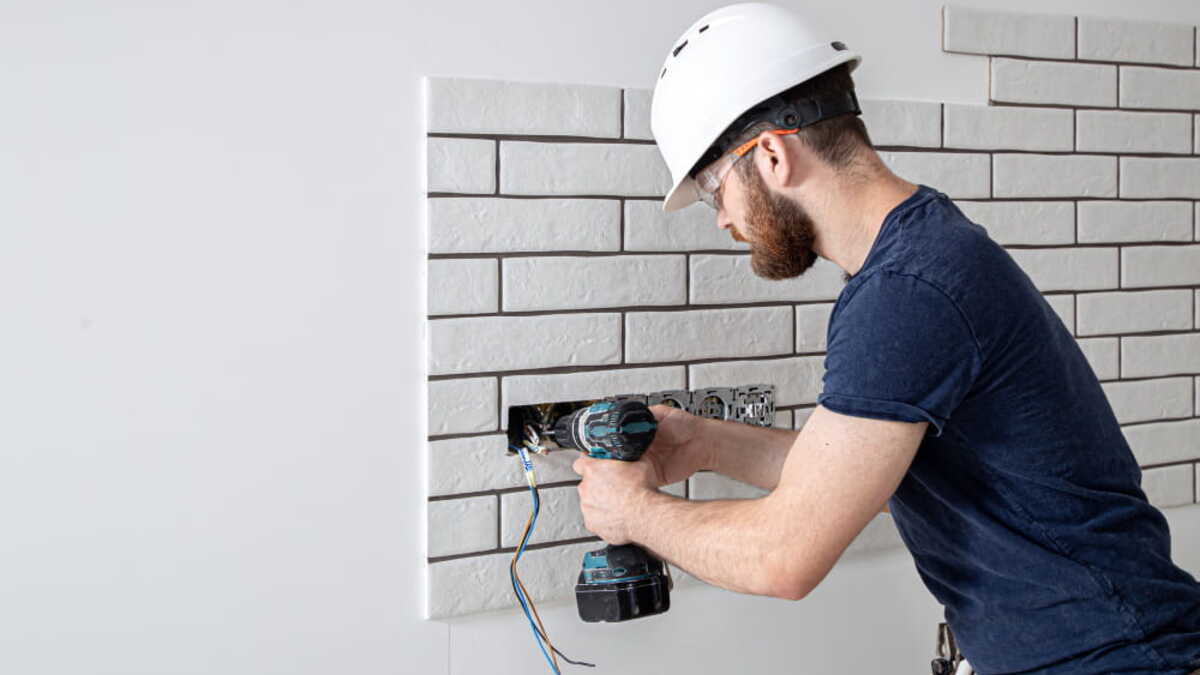 Orlando landlord walking through an occupied rental property with a maintenance checklist
